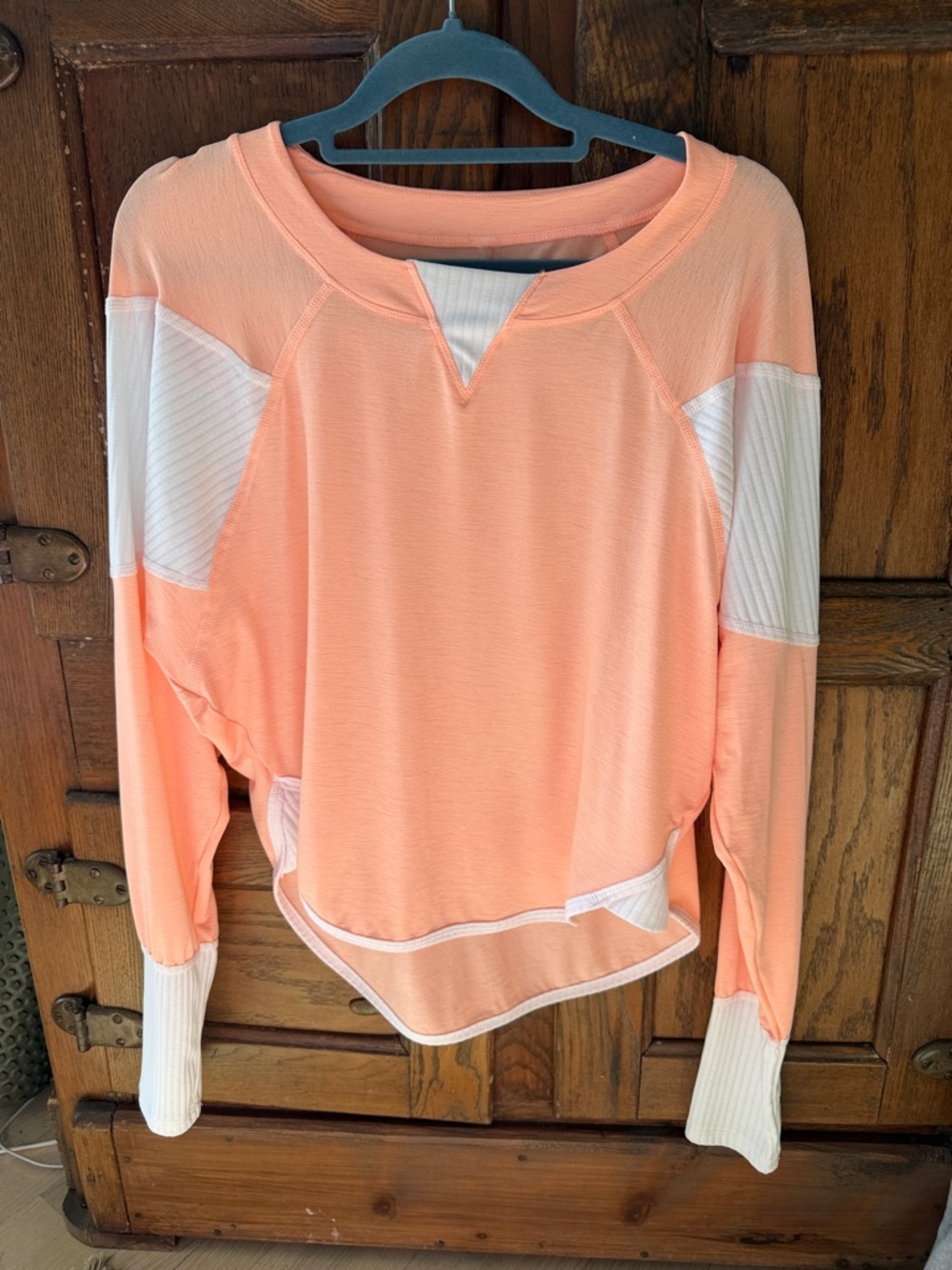 FP Movement by Free People coral with white detail long sleeve top.